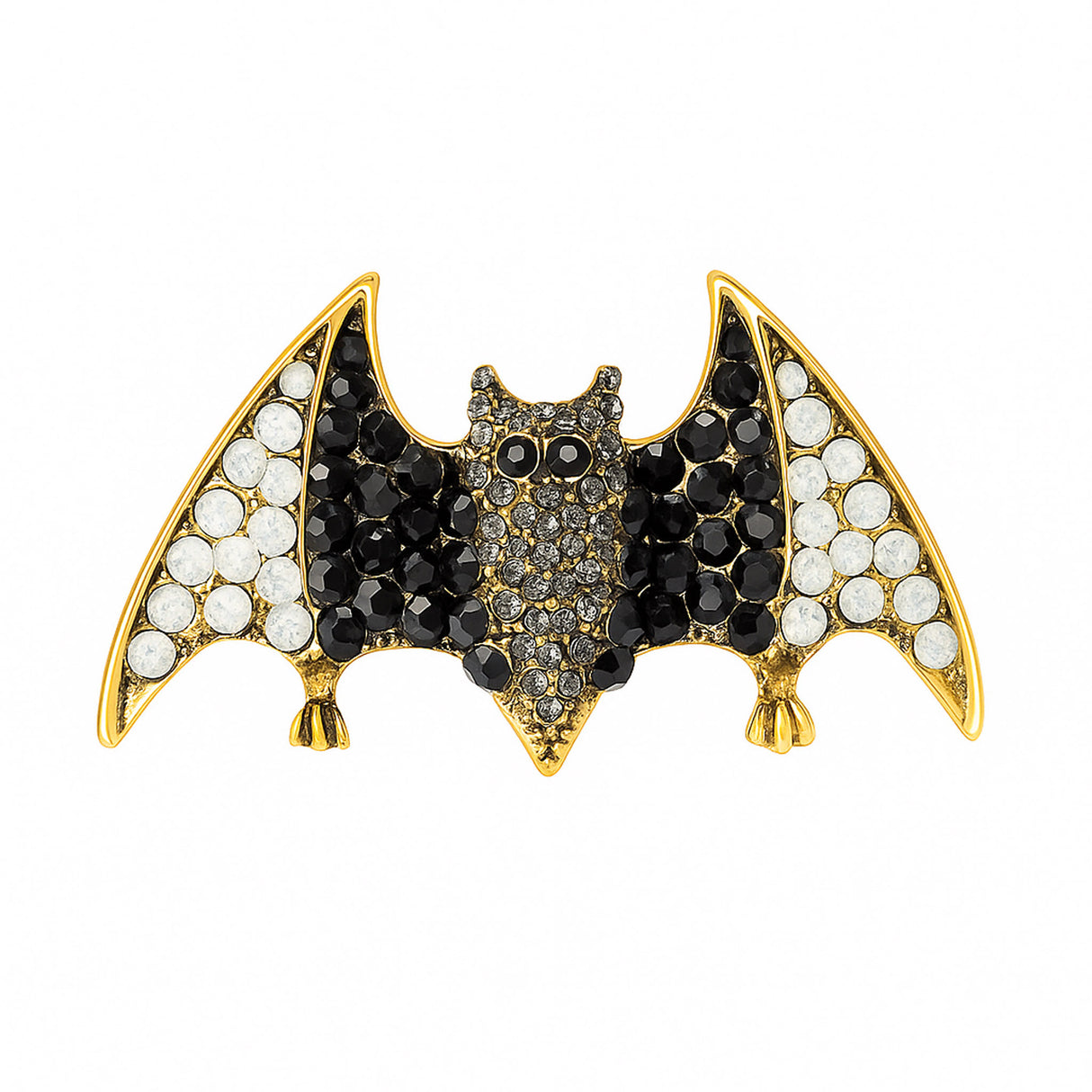 Bat brooch with black and white faceted stones on gold-tone base, cutout on white.