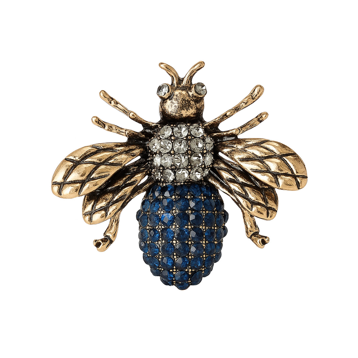 Bee brooch with antique gold-tone wings, clear stones on thorax, and round blue clustered stones on rest of the body, cutout on white background.