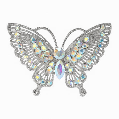 Butterfly brooch with silver-tone metal base and clustered iridescent faceted stones, cutout on white background.