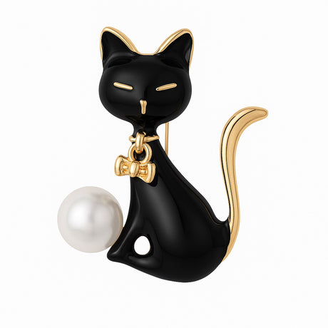 Cat brooch with black enamel body, gold-tone accents, white round faux pearl, and bow detail, cutout on white background.