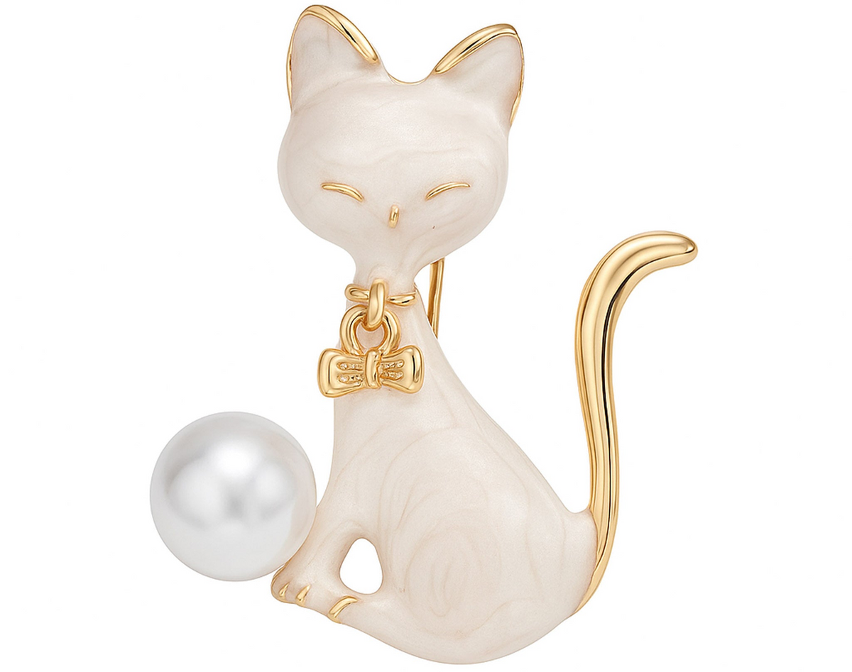 Cat brooch with white enamel body, gold-tone edges, white round imitation pearl, and bow charm, cutout on white background. Landscape crop for secondary use.