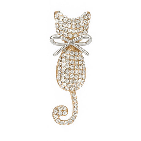 Cat brooch in gold-tone metal finish with clear faceted stones and silver-tone bow, cutout on white background.