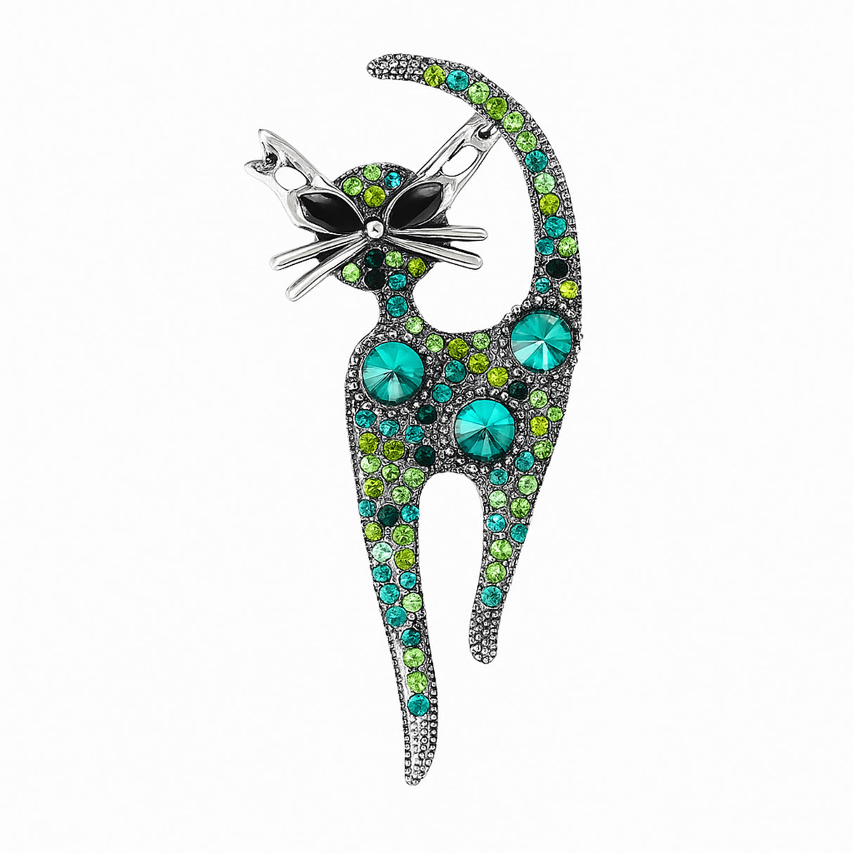 Cat brooch covered with round faceted stones in various sizes and shades of green, set in antique-style silver-tone metal. Cutout on white.