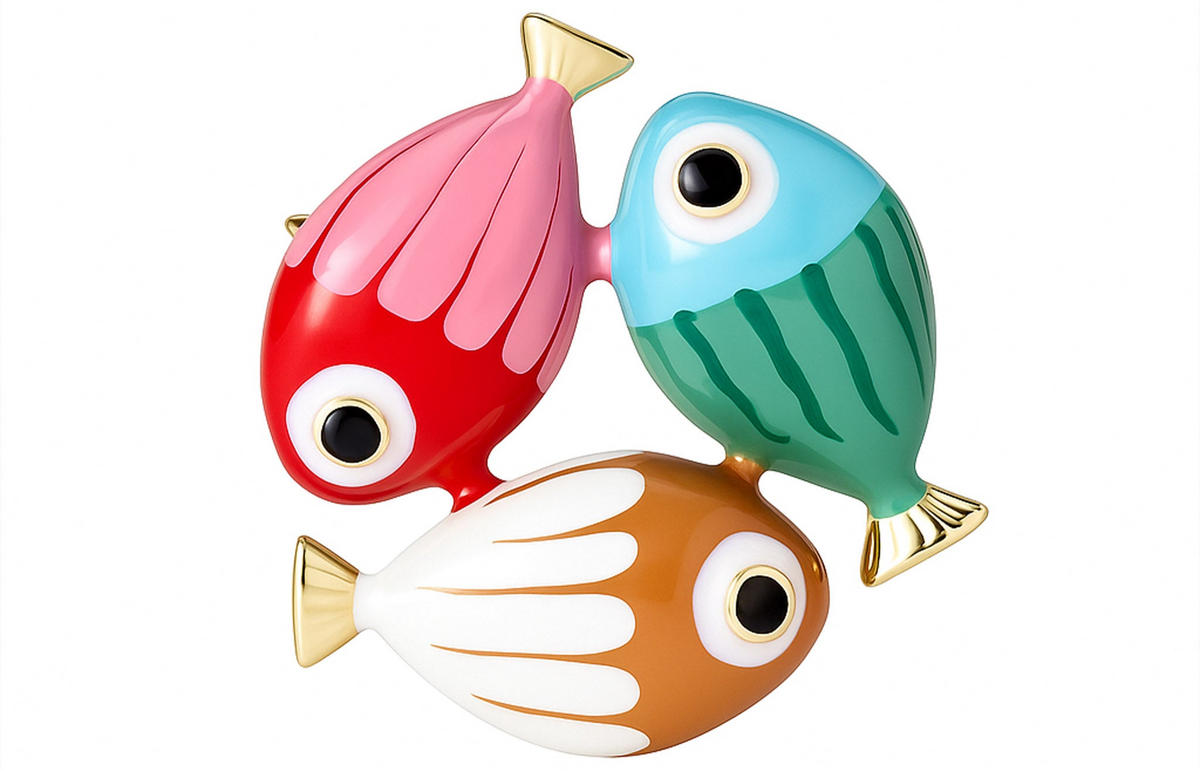 Fish brooch featuring pink-red, blue-green, and white-orange enamel bodies with gold-tone fins, cutout on white background. Landscape crop for secondary use.