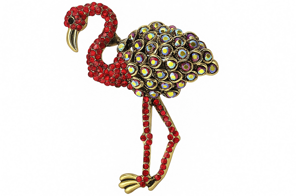 Flamingo brooch with red-tone stones and multicolor reflective round accents on wings, cutout on white background. Landscape crop for secondary use.