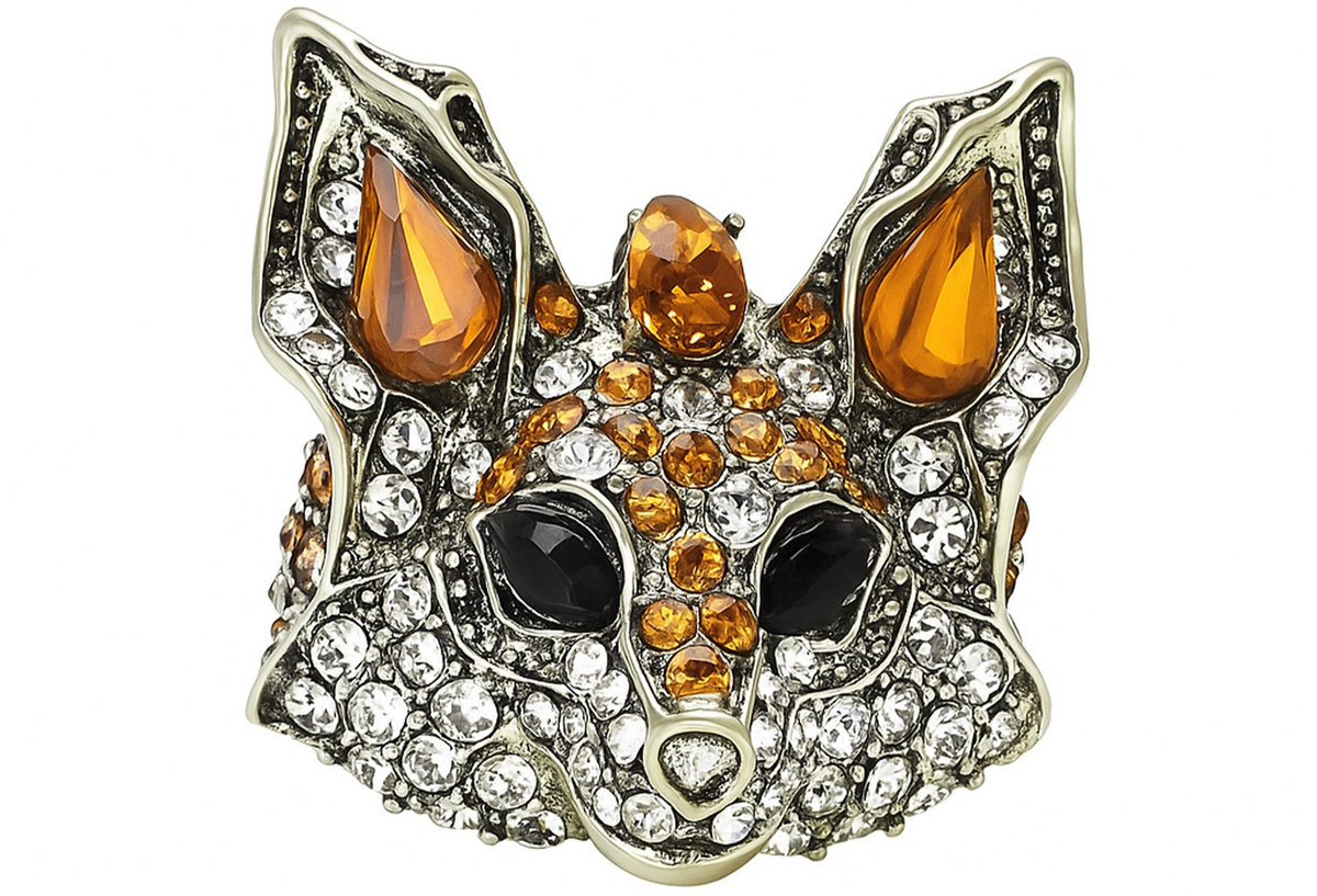 Fox brooch with orange faceted stones, clear round accents, and black eye details, cutout on white. Landscape crop for secondary use.