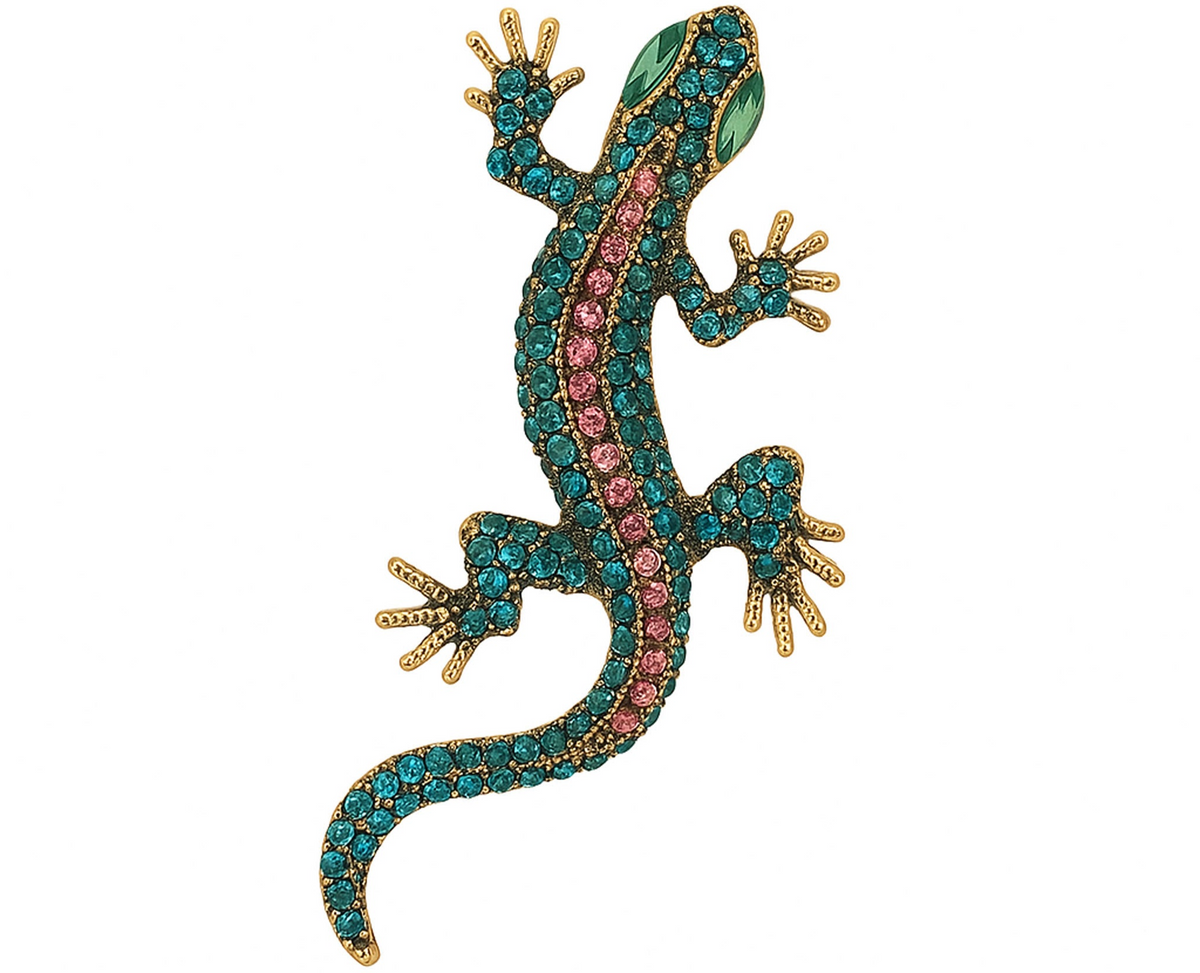 Gecko lizard brooch with teal body, pink faceted center stones, green eyes, and gold-tone claws, cutout on white. Landscape crop for secondary use.