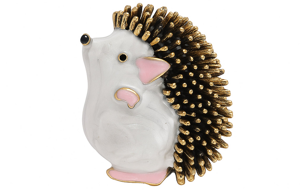 Hedgehog brooch featuring white body, pink accents, and black spines with gold-tone tips, cutout xon white background. Landscape crop for secondary use.