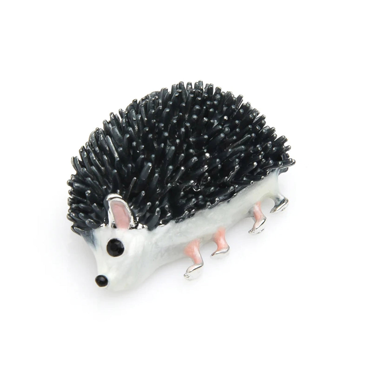 Hedgehog brooch featuring black spines, white body, pink and silver-tone legs, and black eyes, angled side view on white.