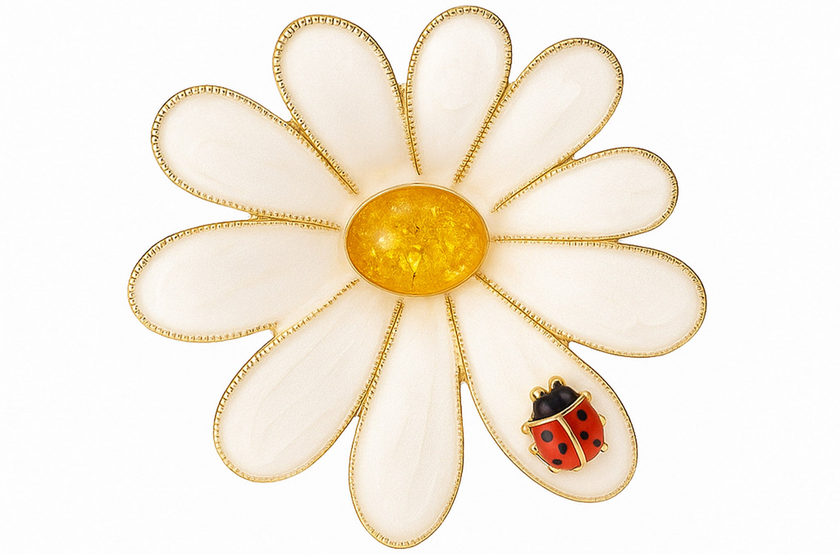 Daisy brooch with gold-tone metal outline, white enamel petals, yellow stone center, and red ladybird charm. Cutout on white background. Landscape crop for secondary use.
