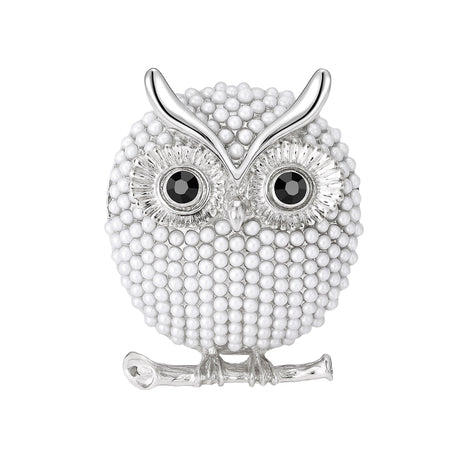 Owl brooch with silver-tone finish, glossy white round beads, black eyes, and curved branch detail, cutout on white background.