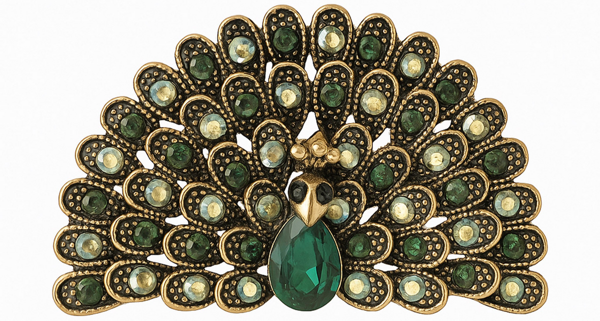 Peacock brooch with green and iridescent stones, gold-tone metal, and green teardrop center stone, cutout on white. Landscape crop for secondary use.