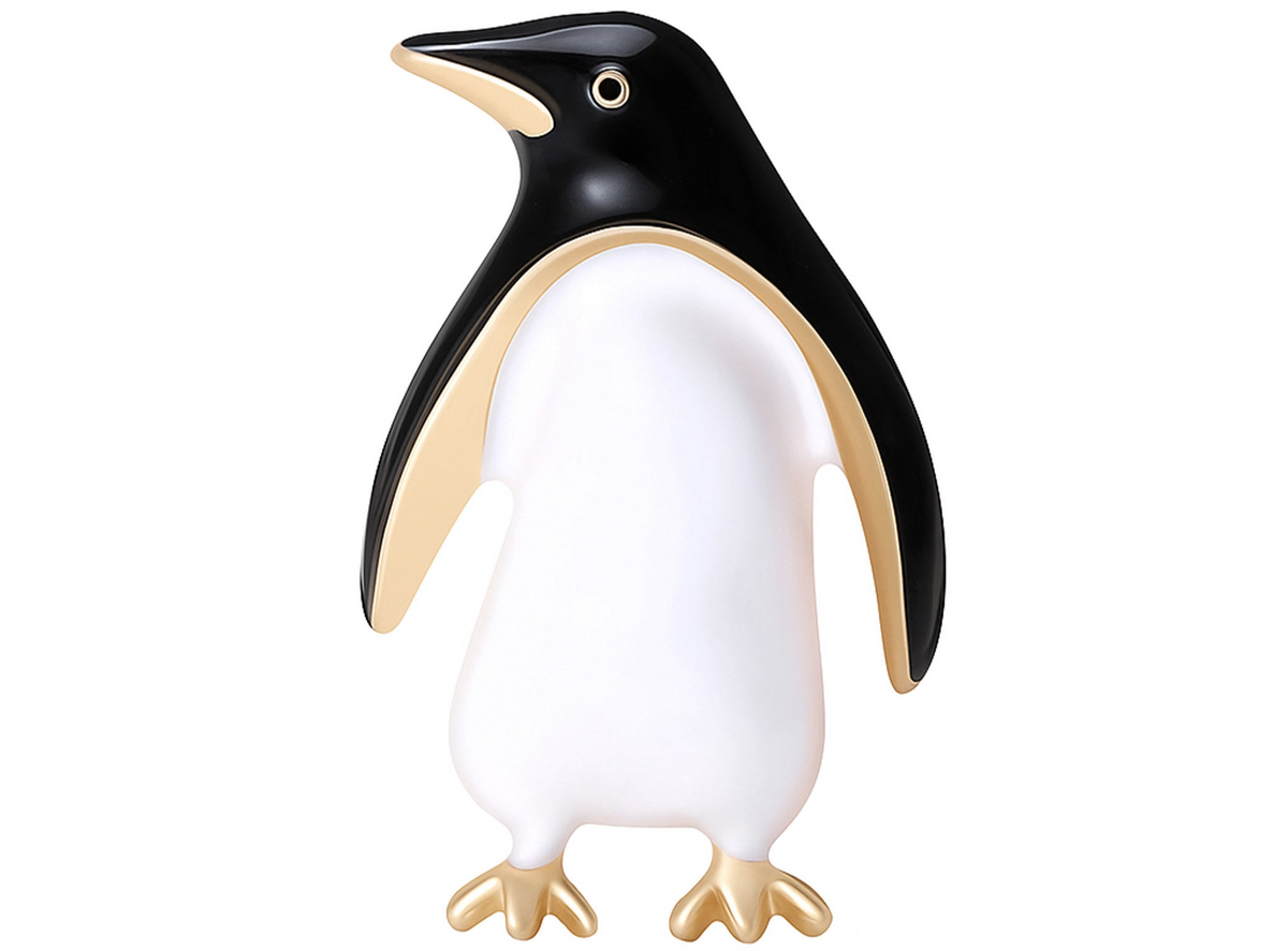 Penguin brooch with black and white enamel finish, gold-tone outline and feet, cutout on white background. Landscape crop for secondary use.