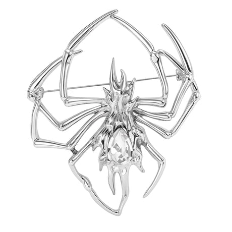 Spider brooch with clear teardrop-shaped faceted center stone set in silver-tone metal. Cutout on white.