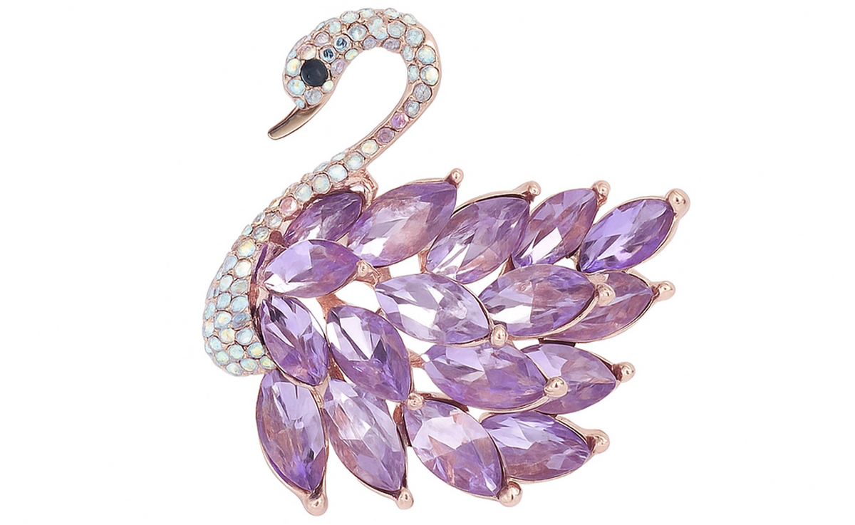 Swan brooch with rose gold-tone metal finish, purple marquise-cut faceted stones, and pavé detailing, cutout view. Landscape crop for secondary use.