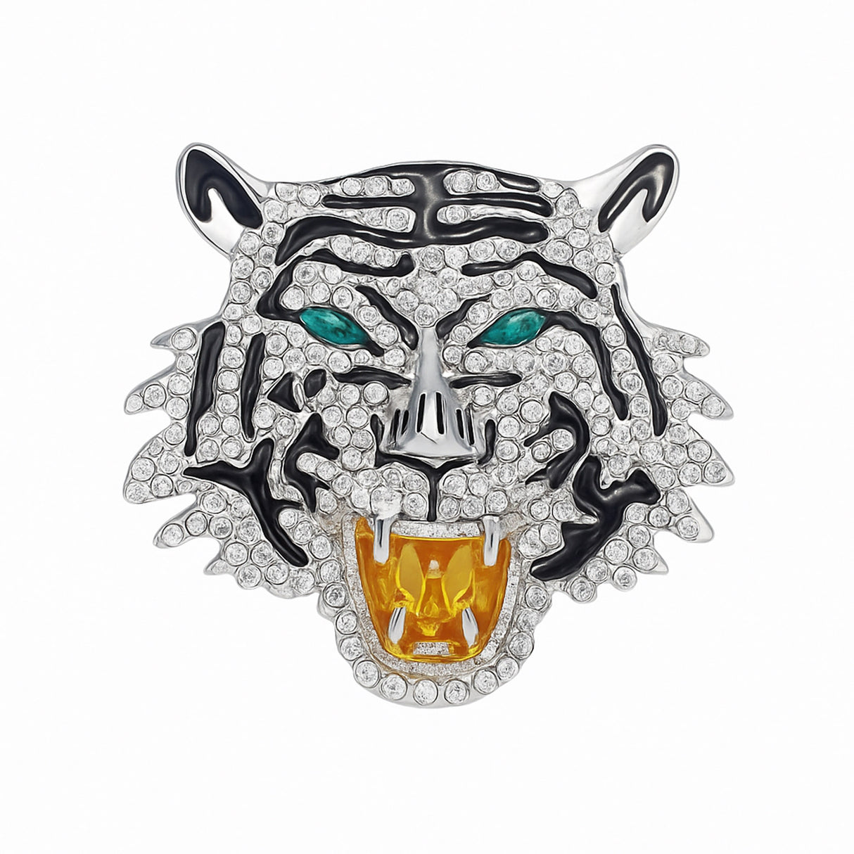 Tiger head brooch with silver-tone base, clear faceted stones, black enamel details, and green-tone eyes, cutout on white.
