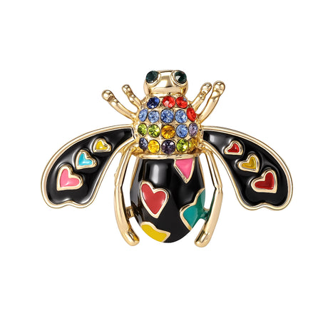 Bee brooch with glossy black enamel wings, multicolor hearts, and faceted stones in rainbow hues, cutout on white.