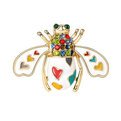 Bee brooch in white enamel with gold-tone frame, rainbow heart inlays, and multicolor faceted stones, cutout on white.