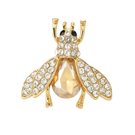 Bee brooch with gold-tone finish, clear round stones and large amber-tone faceted center, cutout on white background.