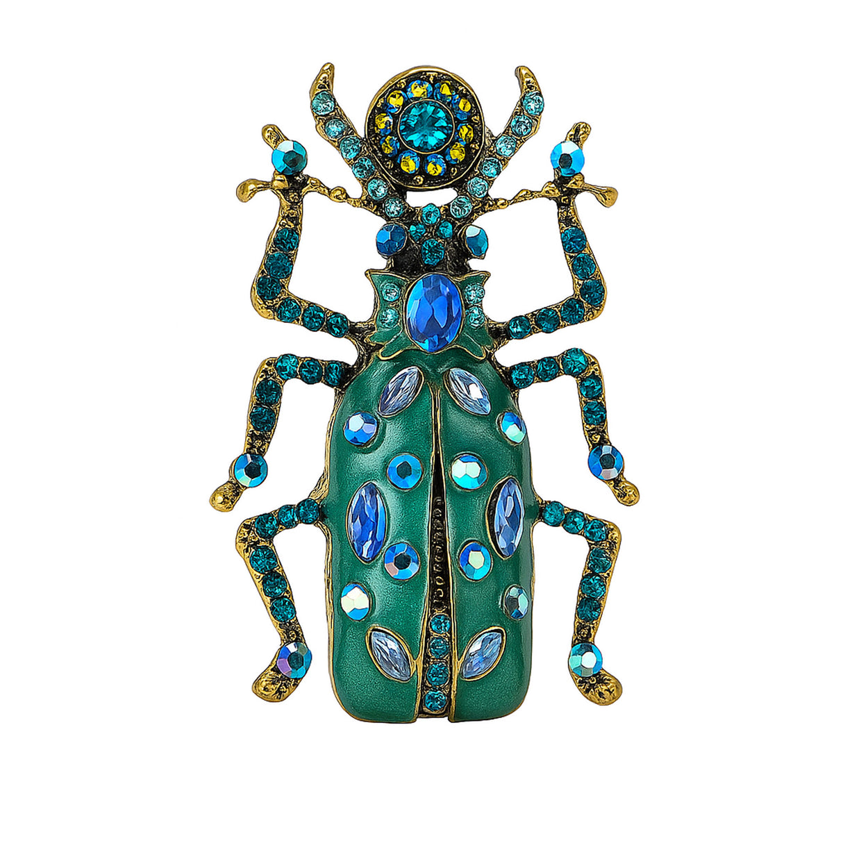 Beetle brooch with teal green enamel wings, blue faceted stones, and gold-tone detailing, cutout on white.