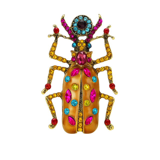 Beetle brooch with orange wings, multicolor stones in pink, yellow, red, and blue tones, cutout on white background.