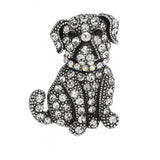 Bulldog brooch with clear round stones, black eyes, and iridescent collar set in vintage-inspired silver-tone metal. Cutout on white background.