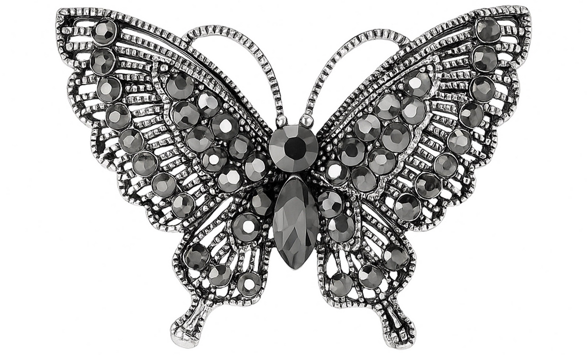 Butterfly brooch with dark gunmetal-tone base and clustered black faceted stones, cutout on white background. Landscape crop for secondary use.