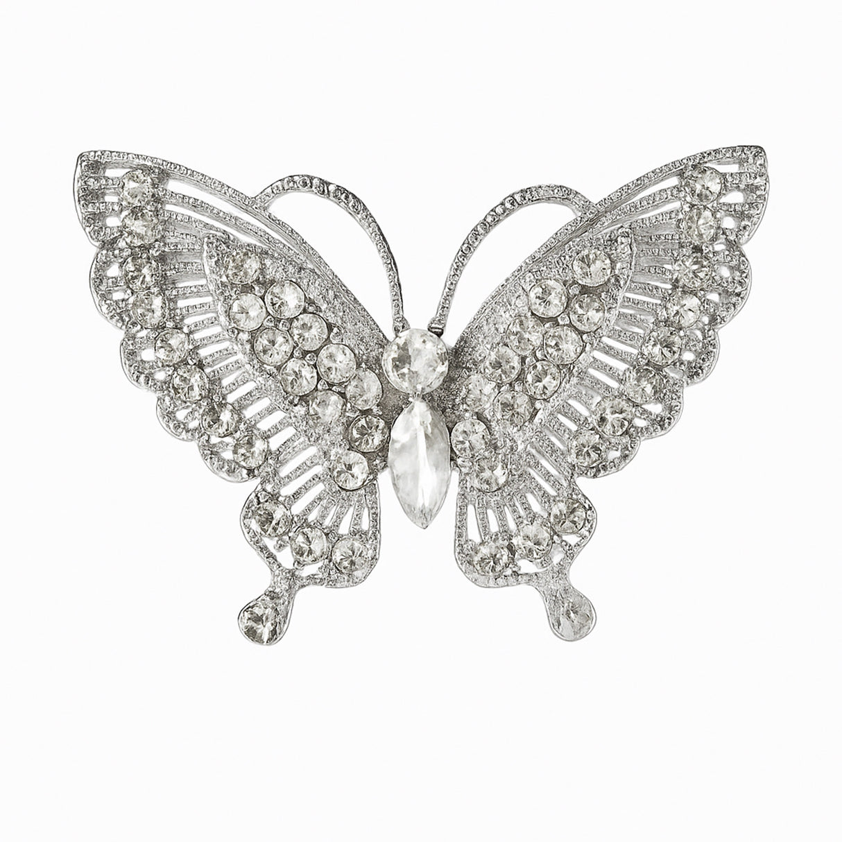 Butterfly brooch with silver-tone base and clear faceted stones arranged in layered pattern, cutout on white background.