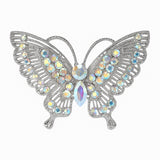 Butterfly brooch with silver-tone metal base and clustered iridescent faceted stones, cutout on white background.