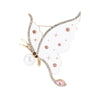 Butterfly brooch with white wings, pink round stones, clear teardrop detail, and faux pearl accent, cutout on white background.