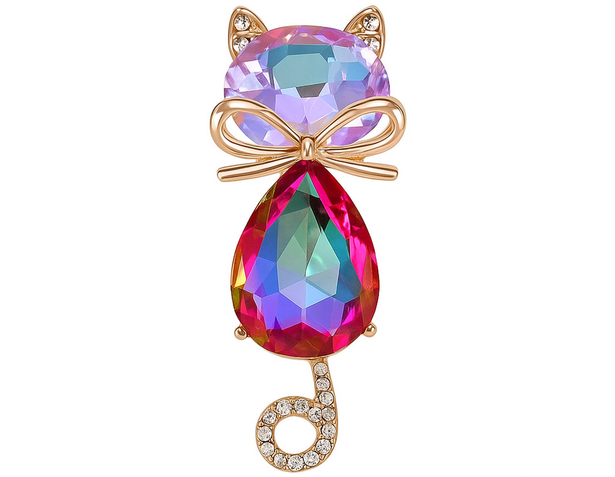 Cat brooch with iridescent pink-purple faceted stones, gold-tone bow accent, and curled tail with clear stones, cutout on white. Landscape crop for secondary use.