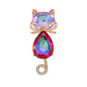 Cat brooch with iridescent pink-purple faceted stones, gold-tone bow accent, and curled tail with clear stones, cutout on white.