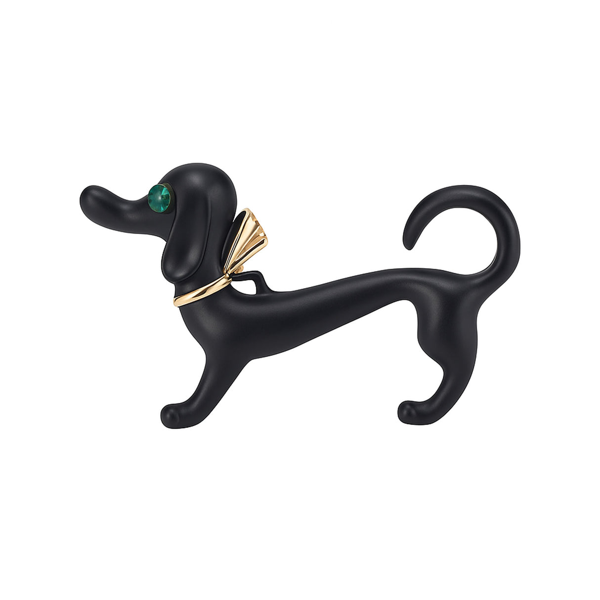 Dachshund dog brooch with matte black finish, green faceted eye, and gold-tone bow accent, cutout on white background.