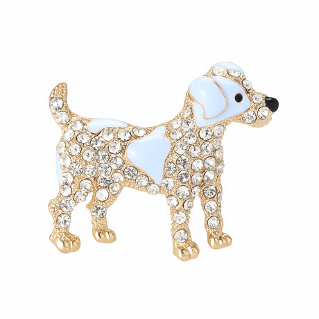 Dog brooch with light blue enamel accents, clear decorative stones, and gold-tone detailing, cutout on white.