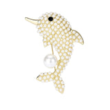 Dolphin brooch with gold-tone metal finish, white round beads, black stone eye, and large hanging faux pearl, cutout on white background.