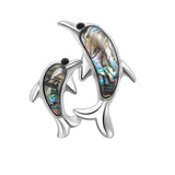 Dolphin brooch with silver-tone outline, black eyes, and vibrant multicolor inlay suggestive of faux abalone shell, front-facing cutout on white background.