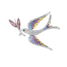 Dove brooch with multicolor wings in yellow, pink, and blue tones, clear faceted stones on body, and pink leaf detail, cutout on white background.