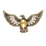 Eagle brooch with gold-tone metal, large yellow faceted center stone, and white accent stones, cutout on white.