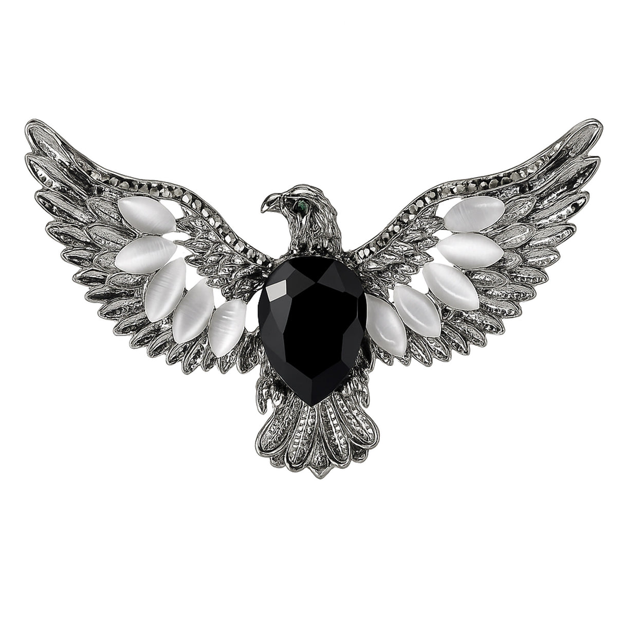 Eagle brooch with silver-tone finish, black faceted center stone, and white oval accent stones, cutout on white.