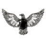 Eagle brooch with silver-tone finish, black faceted center stone, and white oval accent stones, cutout on white.