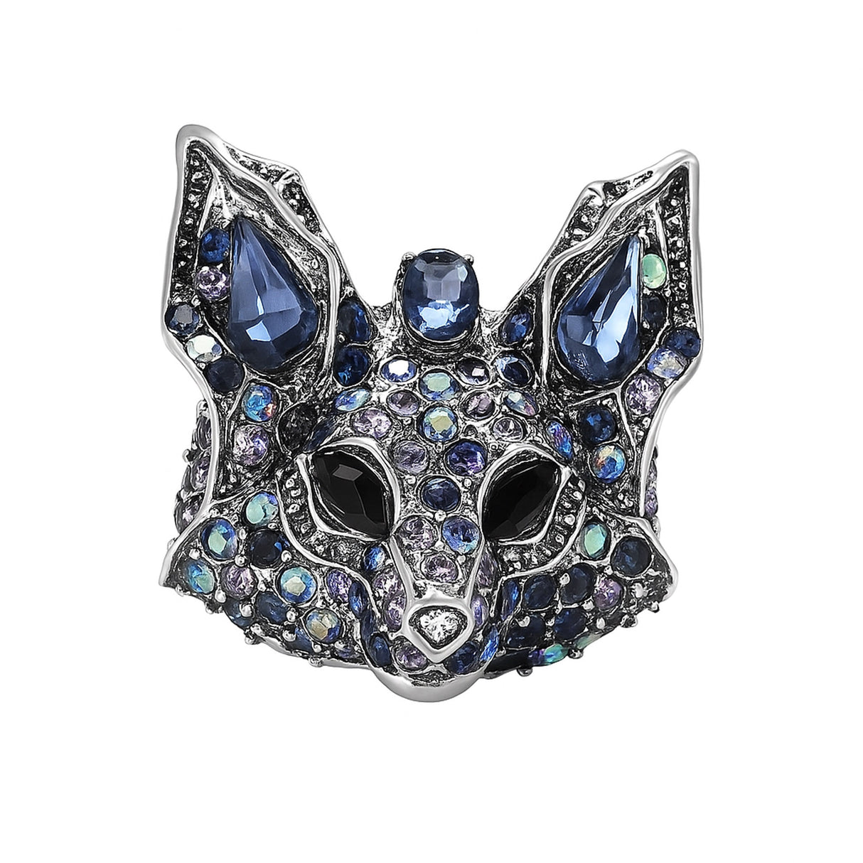 Fox brooch with silver-tone metal, faceted stones in various shades of blue, and black eyes, cutout on white.