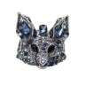 Fox brooch with silver-tone metal, faceted stones in various shades of blue, and black eyes, cutout on white.