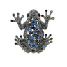 Frog brooch with dark silver-tone finish, decorated with blue and navy faceted stones, cutout on white background.