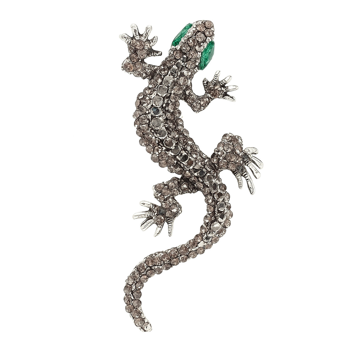 Gecko lizard brooch with silver-tone metal finish, gray faceted stones, and green eyes, cutout on white background.