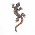 Gecko lizard brooch with multicolor faceted stones in pink, red, blue, and green tones, black eyes, cutout on white.