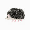 Hedgehog brooch with black and silver-tone textured spines, white body, pink legs, and black eye, cutout on white.