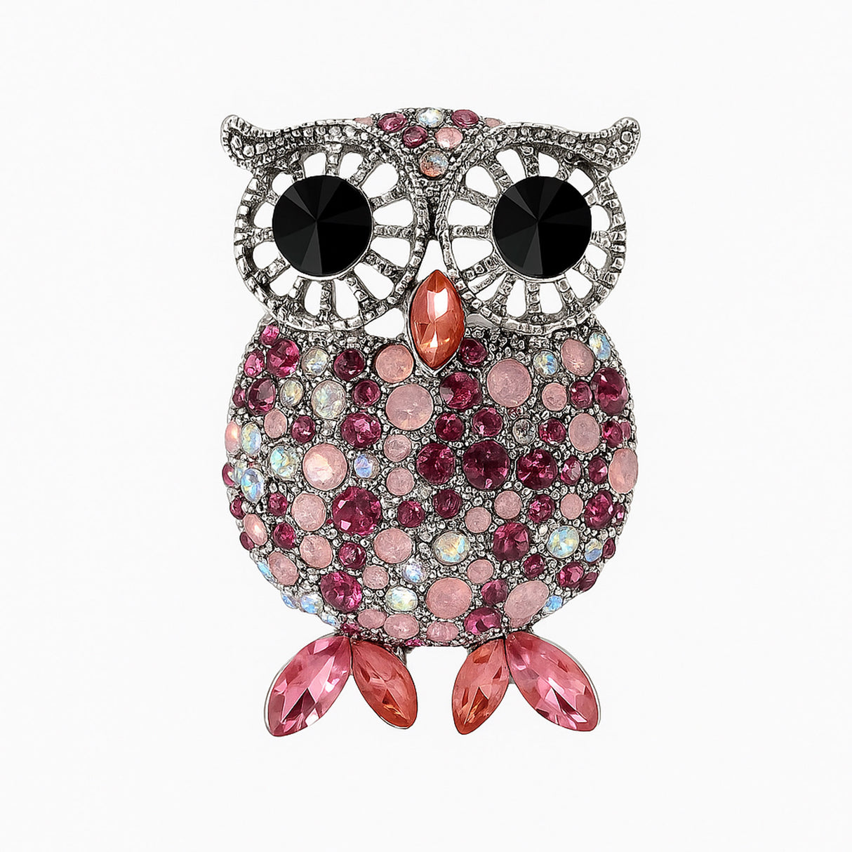 Owl brooch with silver-tone frame, large black eyes, and faceted stones in pink and iridescent tones, with pink leaf-like stones for feet. Cutout on white. 