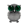 Owl brooch with textured silver-tone metal finish and oversized green faceted stone eyes, cutout on white background.