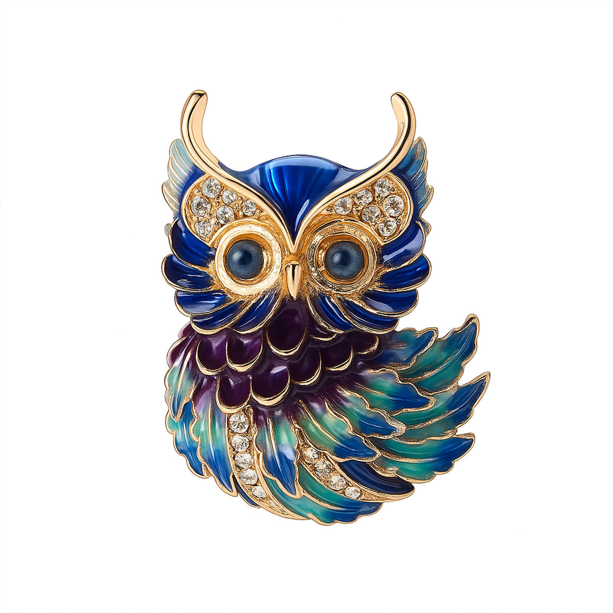 Owl brooch with gold-tone outline, blue and green enamel feathers, clear faceted stones, and round blue eyes, cutout on white.