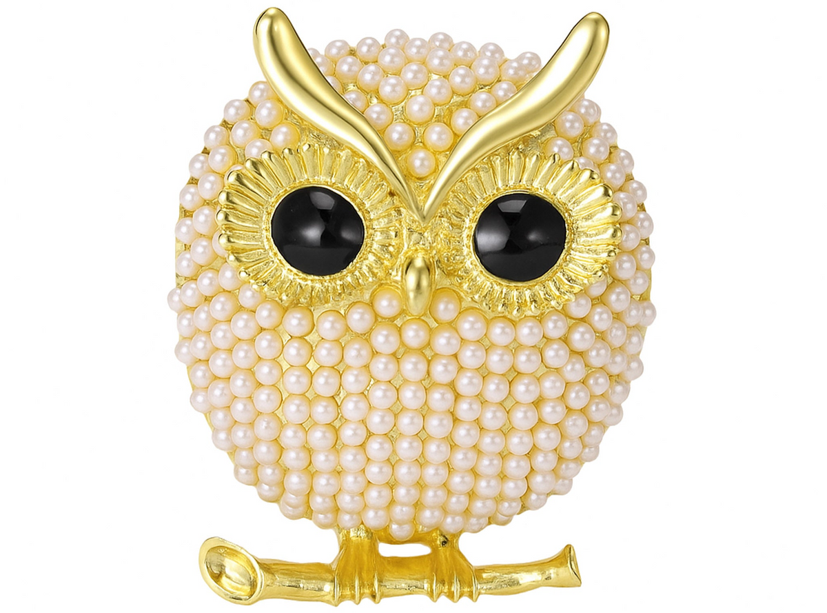 Owl brooch with gold-tone finish, small faux pearl beads, black eyes, and branch element, cutout on white background. Landscape crop for secondary use.